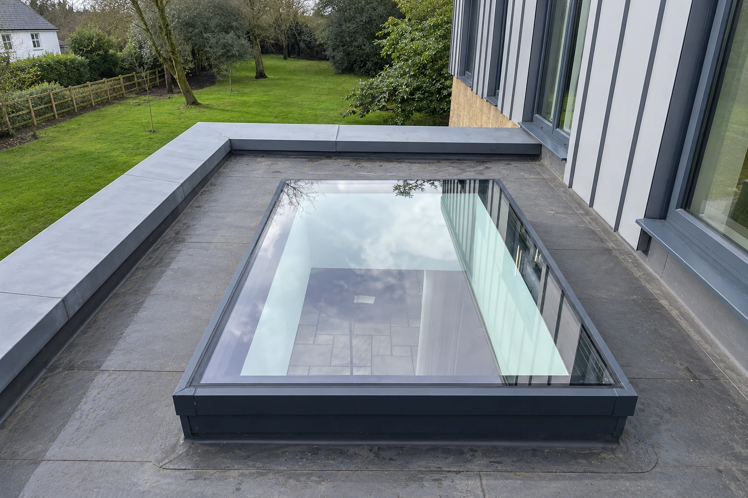 Dark-framed single-pane flat rooflight